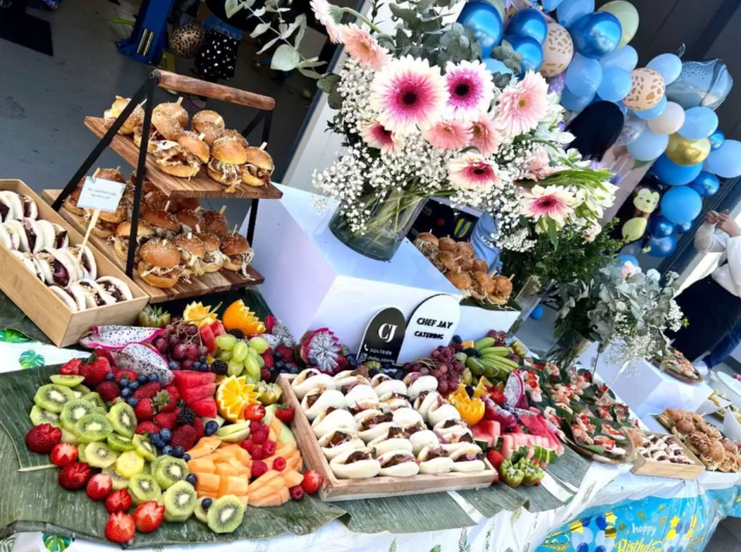 Fruit platter and bao buns at a Chef Jay catered birthday event