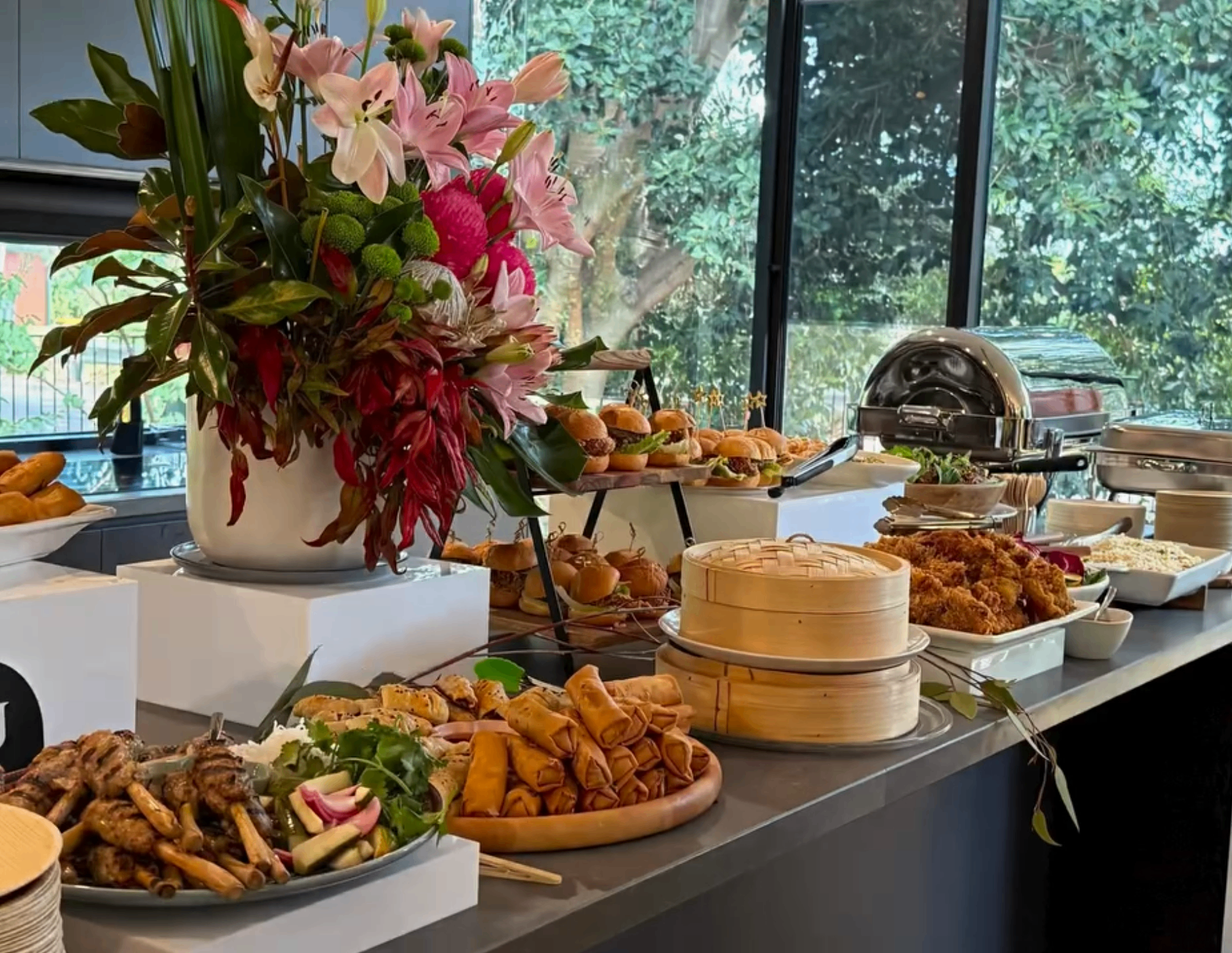 Grazing table styled in front of a window of greenery in Adelaide